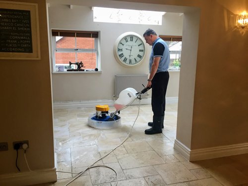 Kevin cleaning Travertine floor