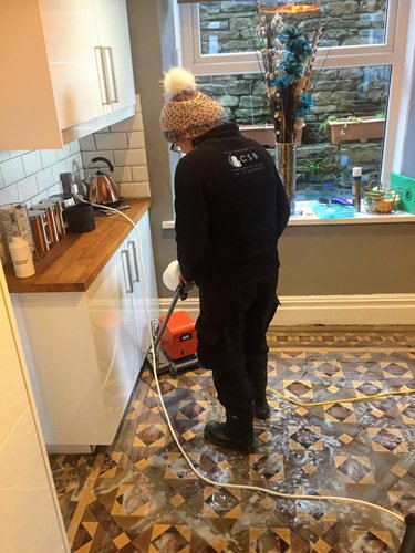 Mair cleaning Victorian tiles with a Tile master machine