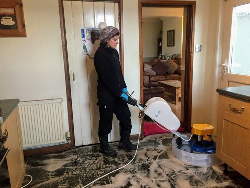 Mair cleaning a slate floor with a Klindex Rocky machine