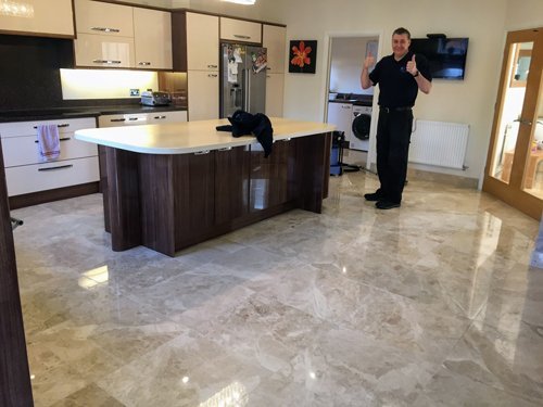 Kevin standing on a Marble floor in a Kitchen